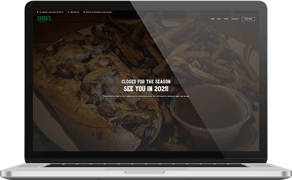 Green&rsquo;s Barbecue Bar website shown on a laptop